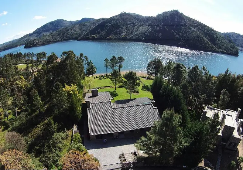 The lakeside house and the lake from above